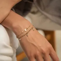 Leuk gouden armbandje - Goed te combineren - Schattig verjaardagscadeau - Armbandje met licht groene kraaltjes