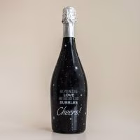 wijn met lichtjes, mooie fles wijn, wijn met bubbels