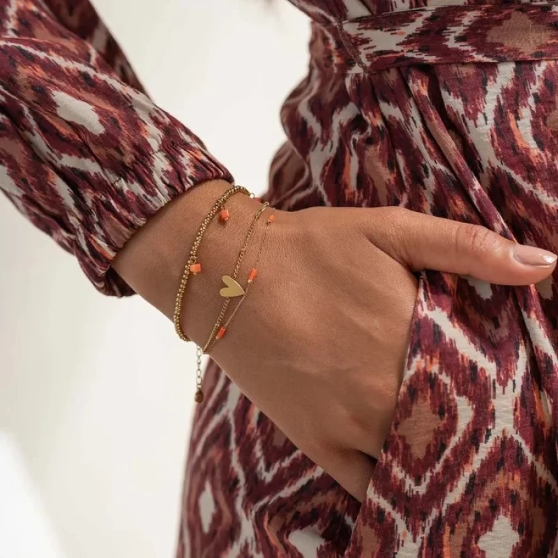 Zusss armbandje 'Heel veel liefs' in goud met koraal of saliegroen