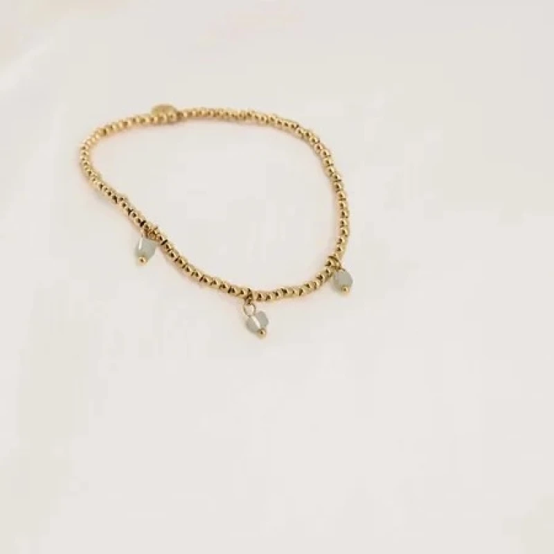 Zusss armbandje 'Heel veel liefs' in goud met koraal of saliegroen